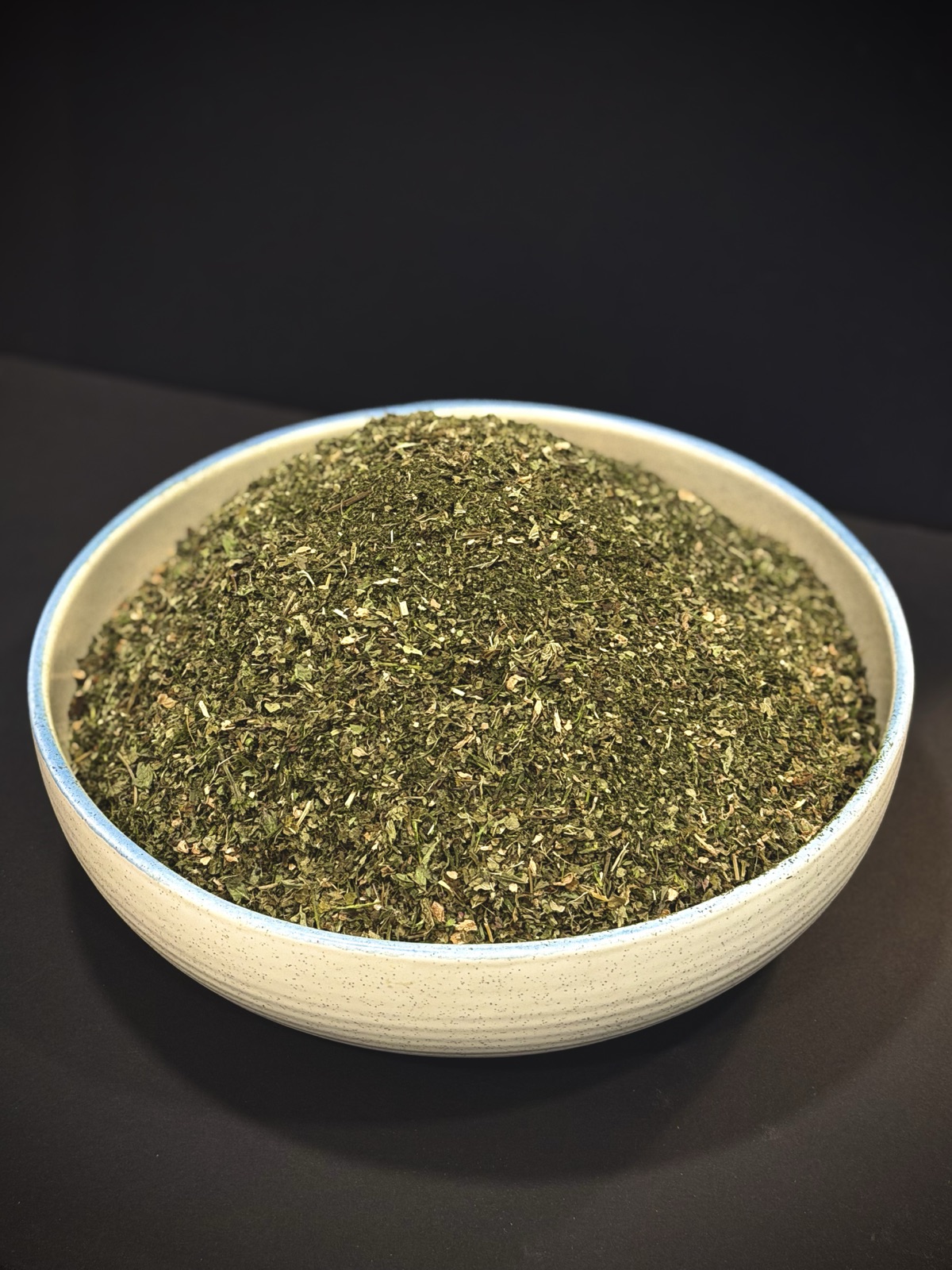 A ceramic bowl filled with Sovereign Standard tea, resting in natural light